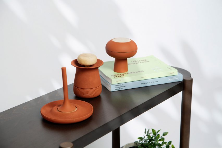 Photograph showing terracotta-like smart home devices on table