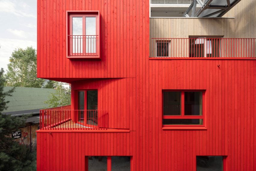 Red wood cladding on the Haus 2+ office building by Office ParkScheerbarth