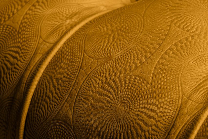 Yellow embossed leather with Tribal pattern on arm of Chester armchair
