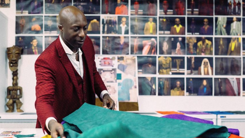 Ozwald Boateng in his studio with embossed leather textile samples