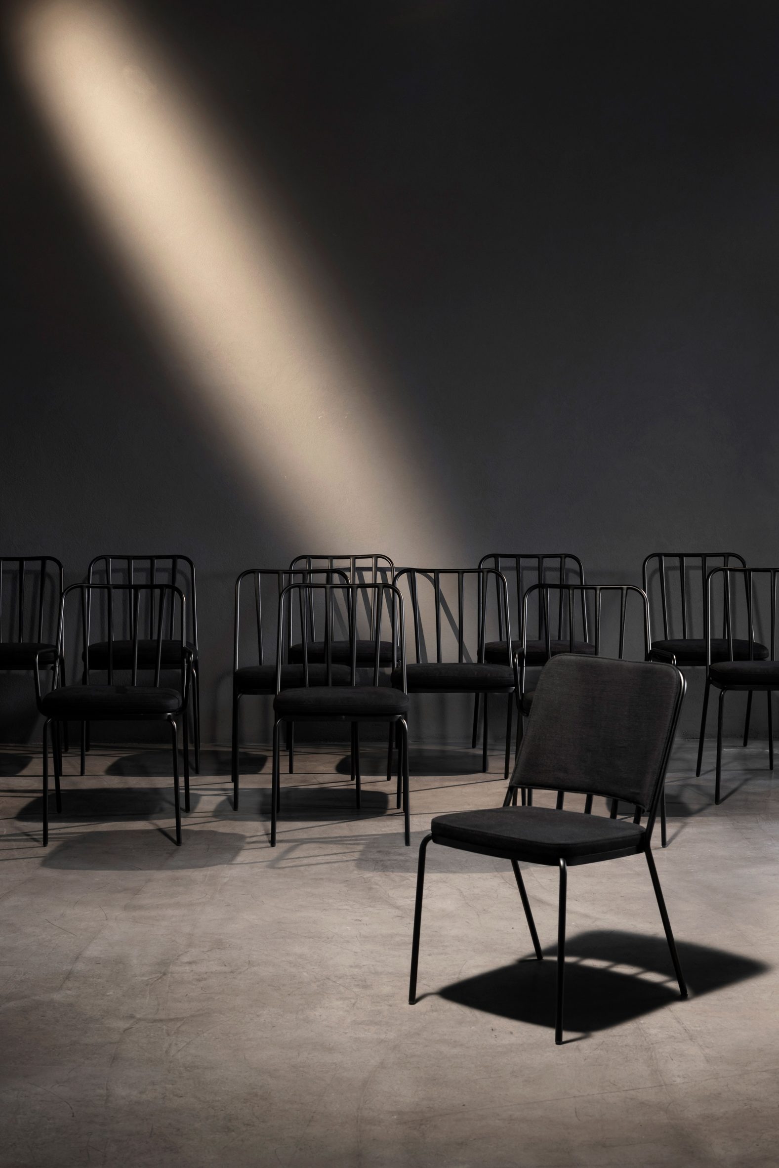 Black Palm X chairs by Jean-Michel Wilmotte for Parla lined up in a row with one in the front