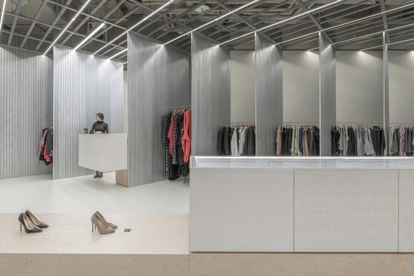 Clothes displays and cash desk inside SOM Store by D415 in Bratislava