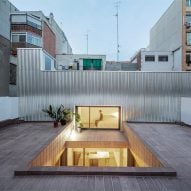 CRÜ transforms public laundry into La Clara house in Barcelona