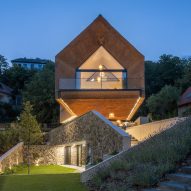 RAPA combines thatch and stone at lakeside holiday home in Hungary