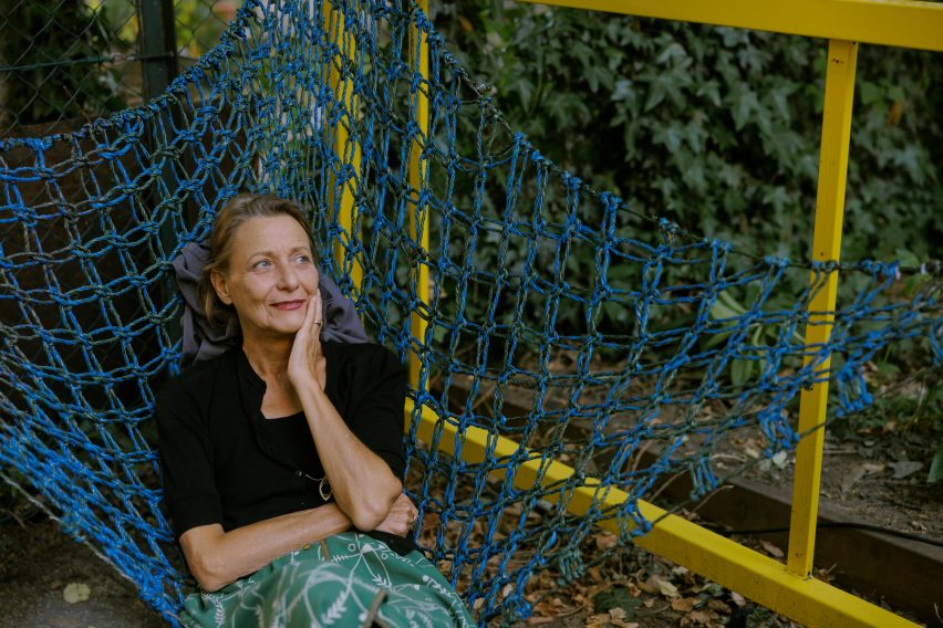 Woman sitting in Urban Networks hammock chair designed Membran for Vienna Design Week