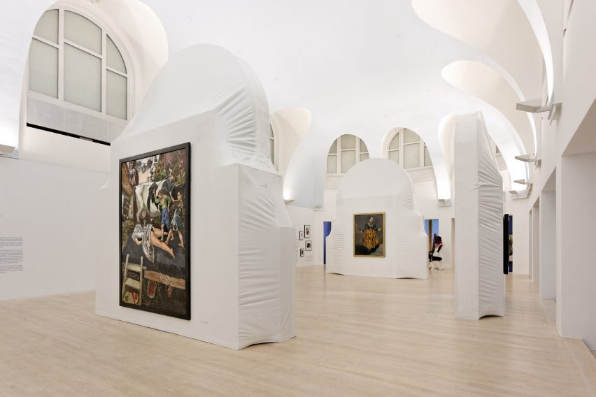 White exhibition space with arched clerestory windows