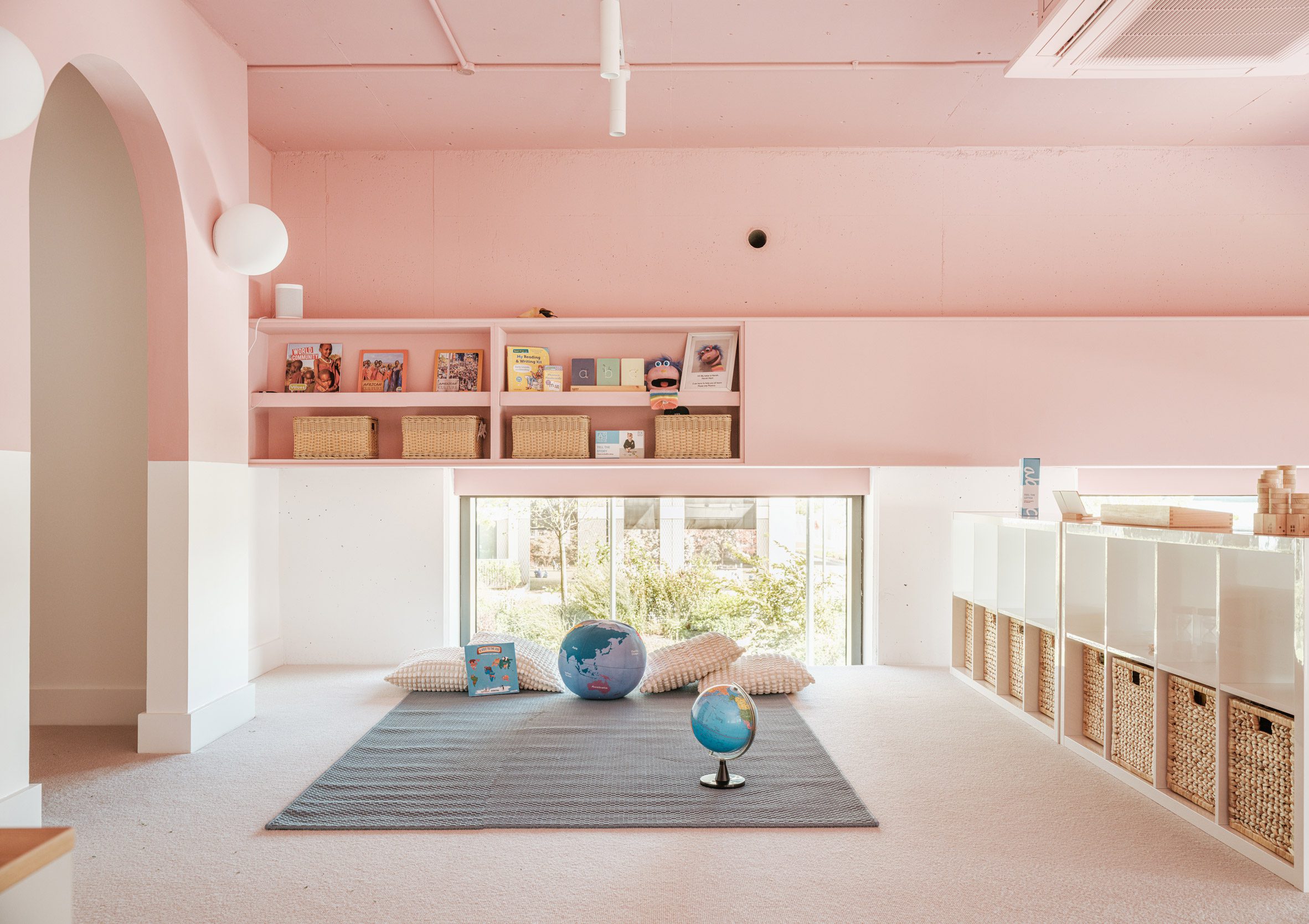 Pink-toned mezzanine of kindergarten in east London by Delve Architects