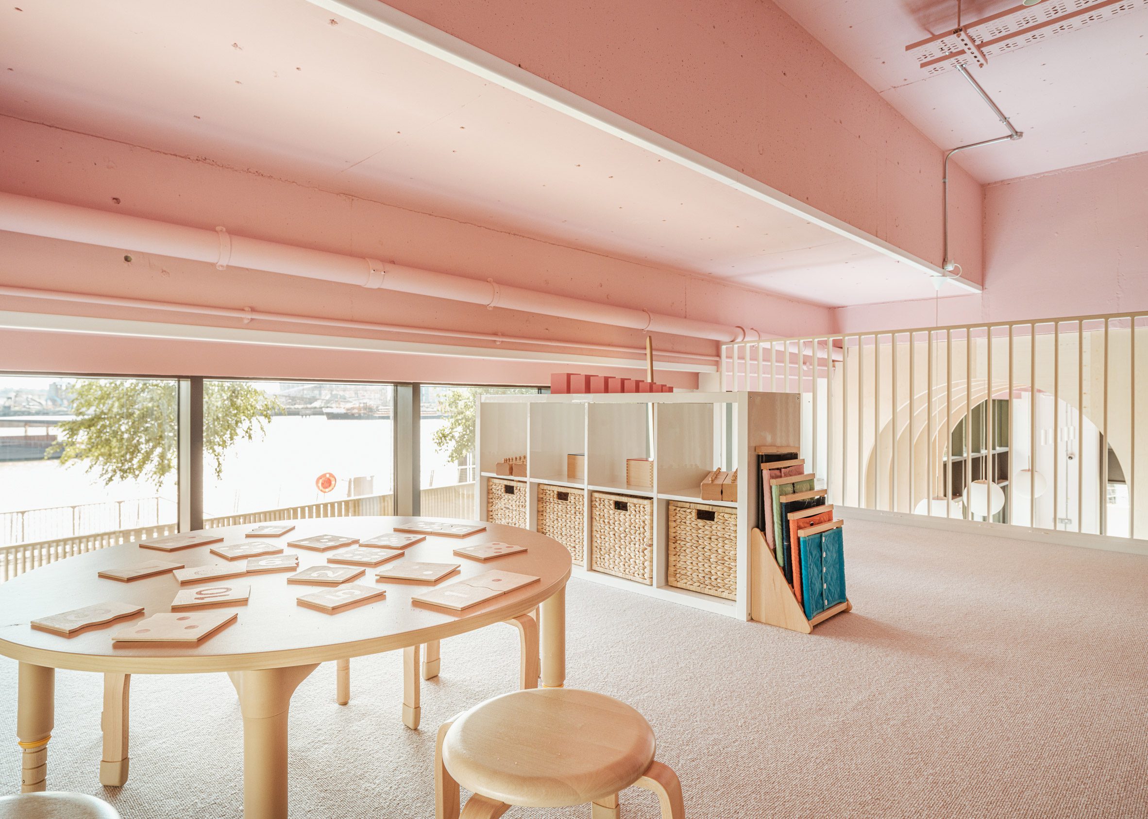 Pink-toned mezzanine of The Nest nursery 