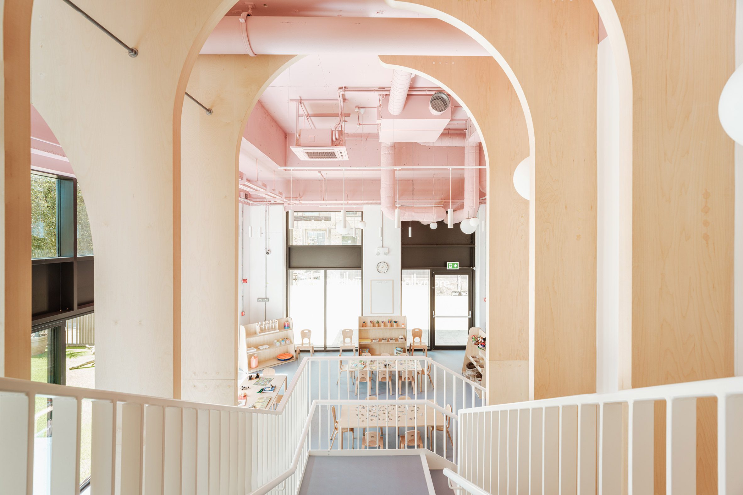 View from stairs of east London kindergarten by Delve Architects