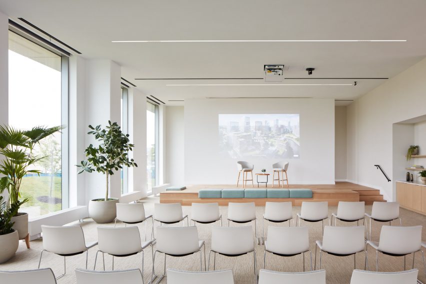 Bright conference room with chairs facing a stage