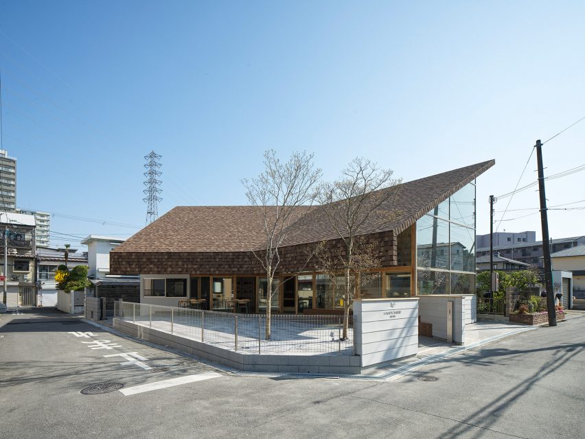 View of library by Yukawa Design Lab showing kinked facade and shingle-covered roof