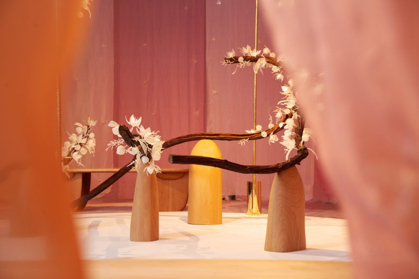 Floral art installation with long branches called The Pollination Dance