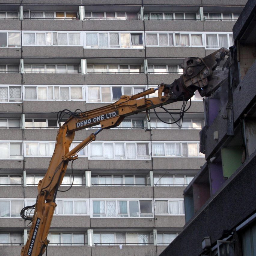A crane tearing down buildings on the Aylesbury Estate in London