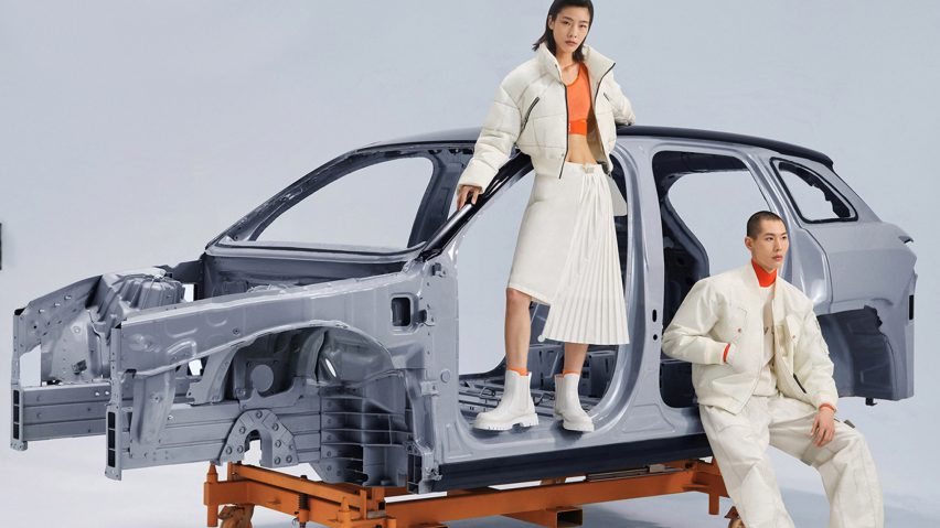 Models posing in front of a gutted Nio car in Blue Sky Lab clothing