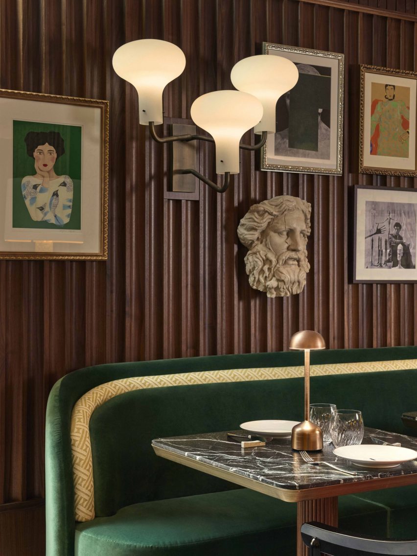 Wood panelling and artworks inside restaurant by Humbert & Poyet