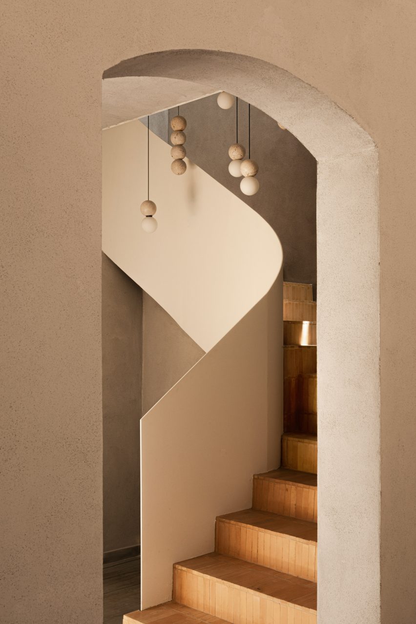 Staircase with thin balustrade and handmade brick steps