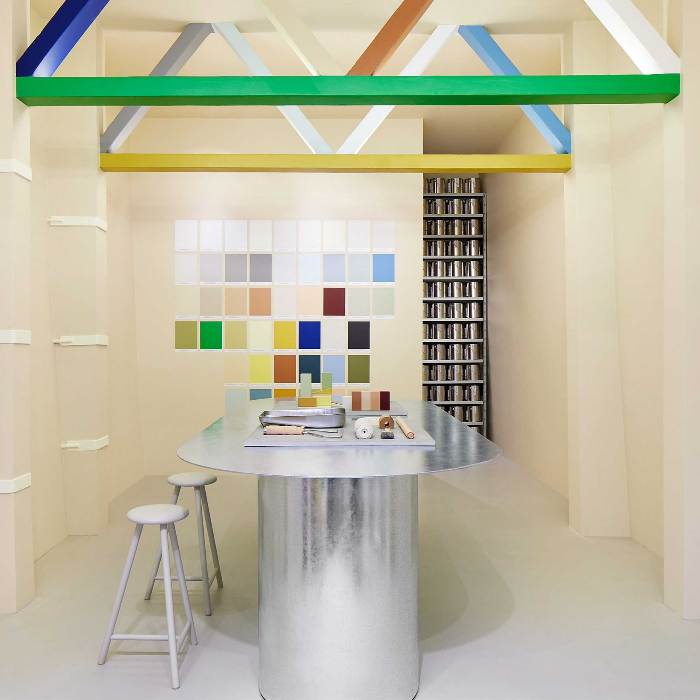 Oversized colourful beams within an Amsterdam paint shop