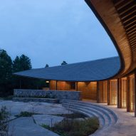 Curving exterior of Dapi Mountain Restaurant by Galaxy Arch