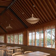 Timber restaurant interior overlooking a hillside
