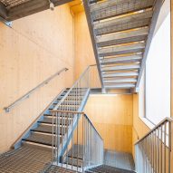 CLT interior with metal staircase at Workstack by dRMM