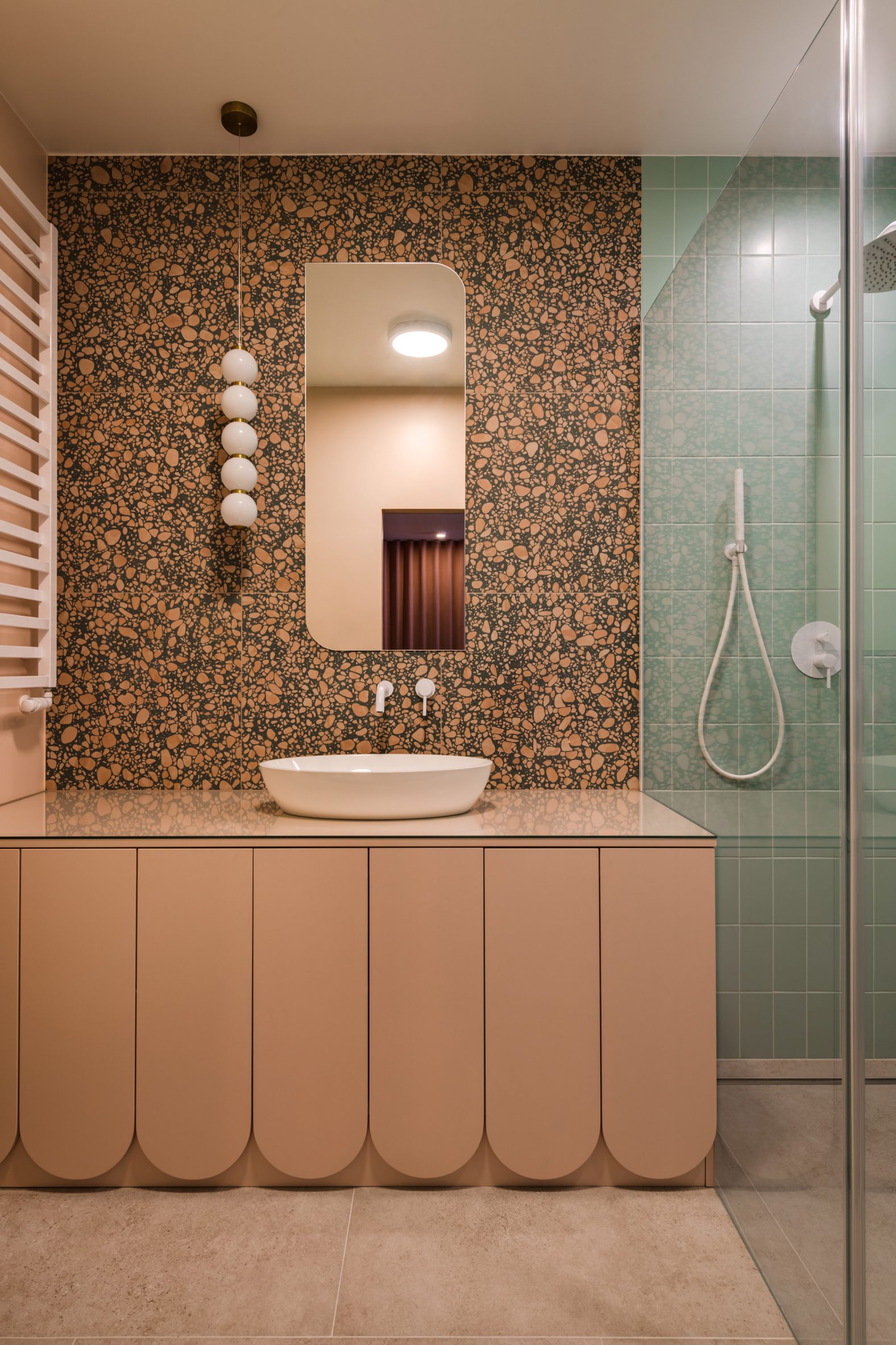 Bathroom with terrazzo tiles and a walk-in shower