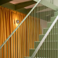 Green-painted metal staircase