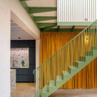 Green-painted stairs at Green House by Hayhurst and Co