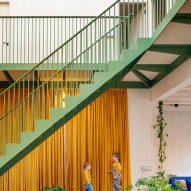 Atrium with a green-painted staircase