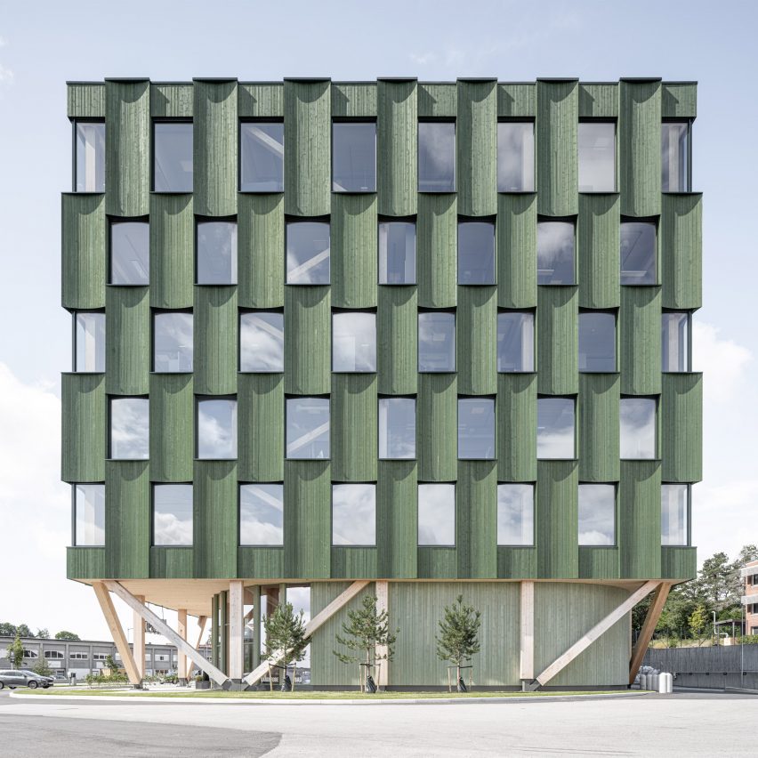 Curved panels of green timber clad office in Norway by Oslotre