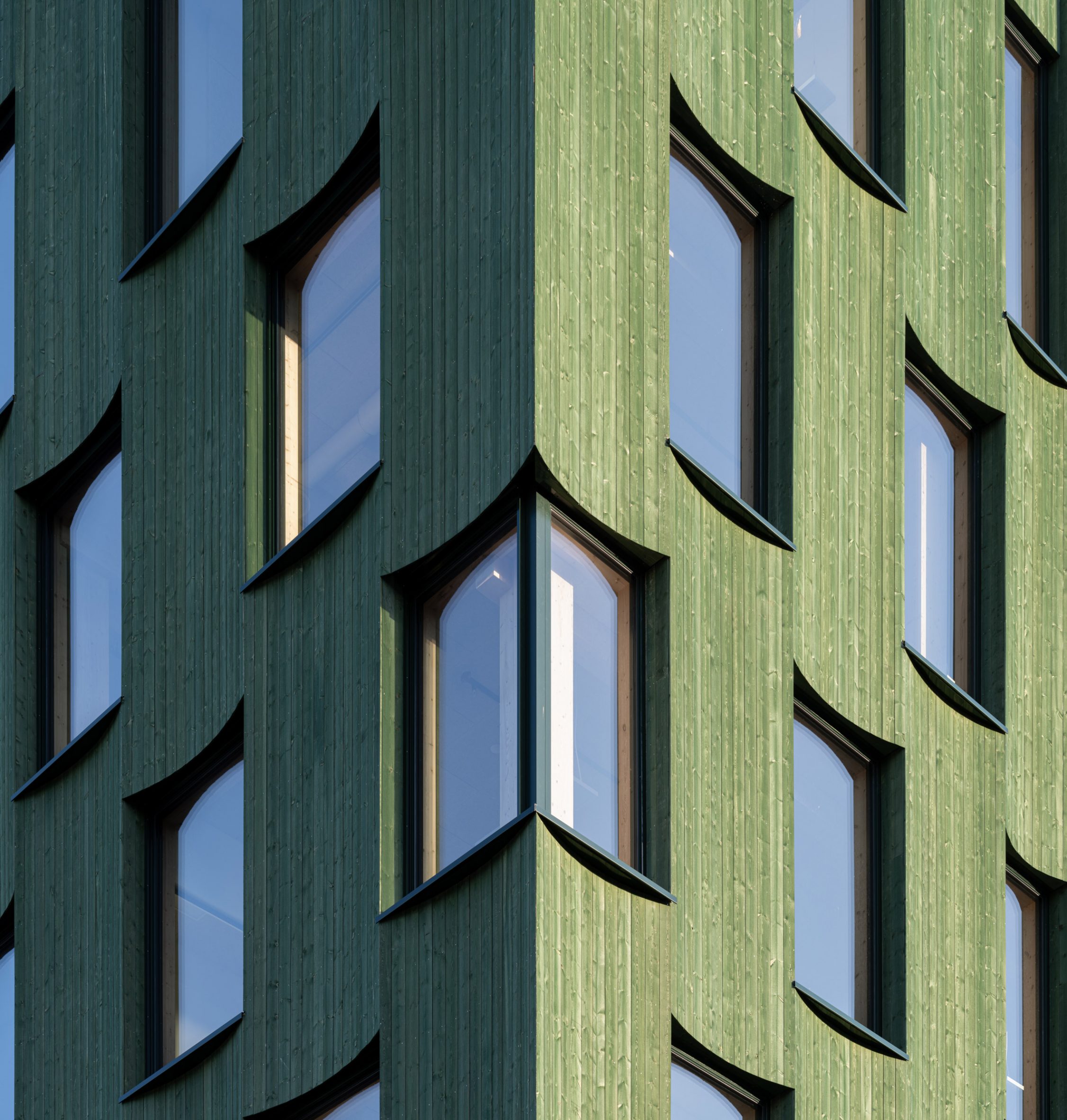 Glazed and green timber clad office in Norway by Oslotre