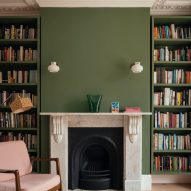 Victorian fireplace with new green walls and bookshelves