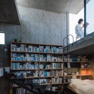 Bookcase wall in a concrete home