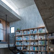 Bookcase wall in a concrete home