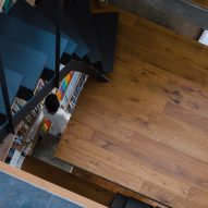 Black metal staircase in a home with wood flooring
