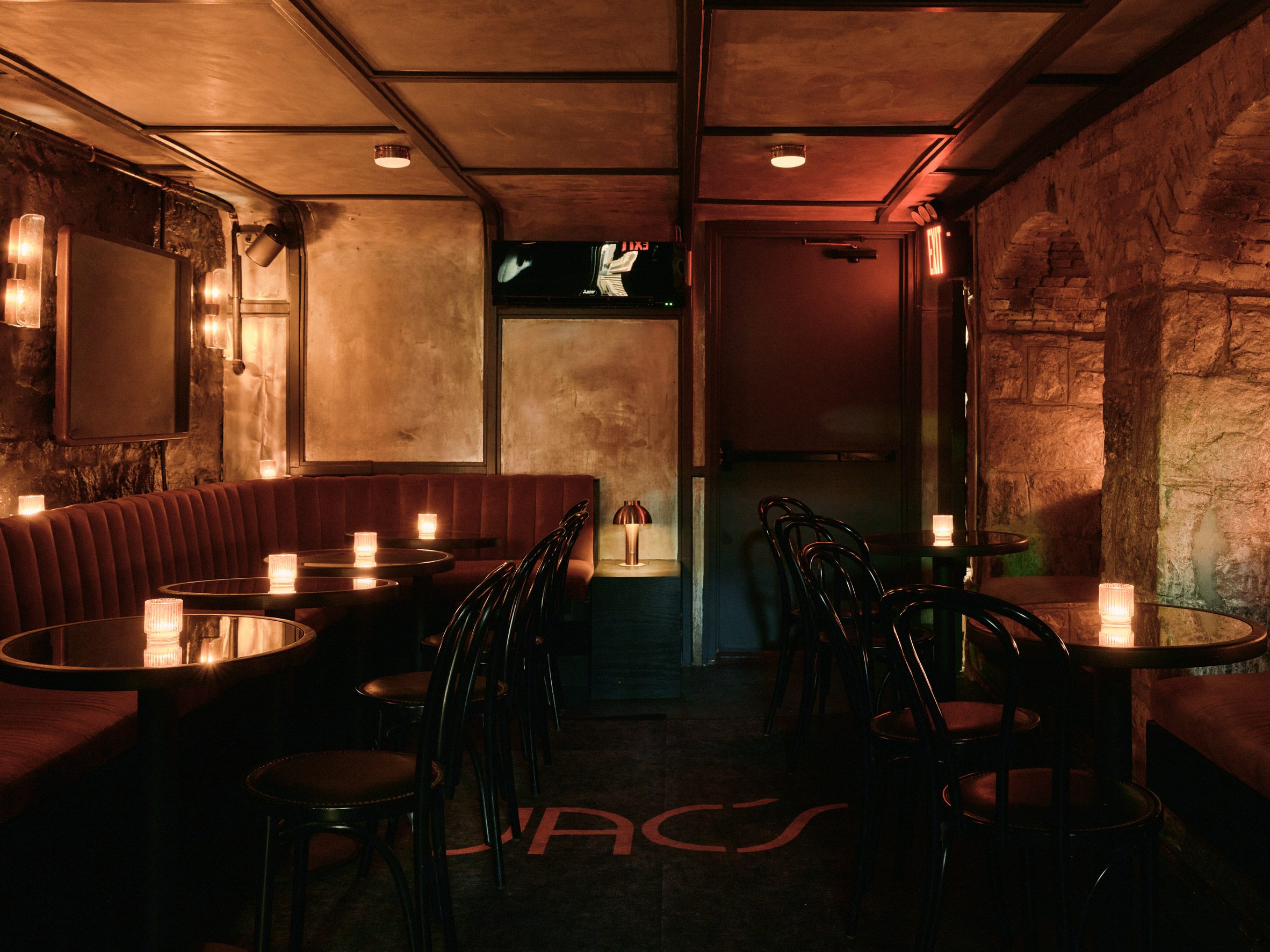 Dimly lit basement bar in a former wine cellar