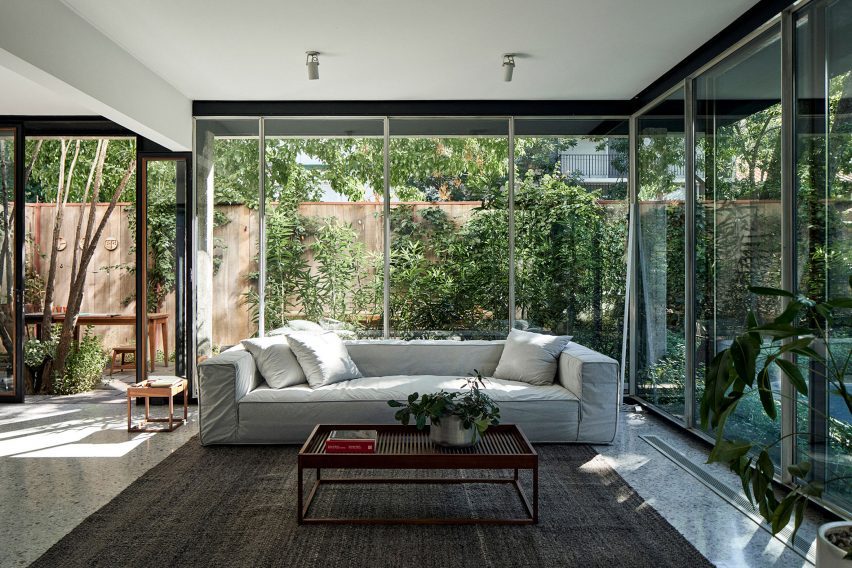 Floor-to-ceiling glazing and vegetation