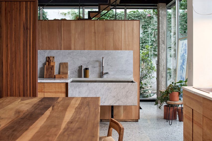 Wooden kitchen within Casa Mendoza by La Base Studio