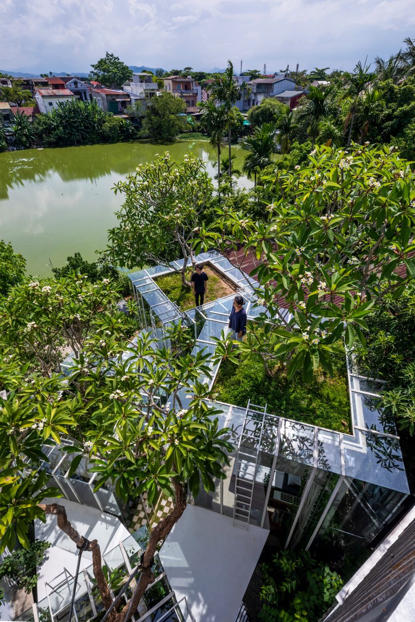 Aerial view of a house next to a pond in Hue