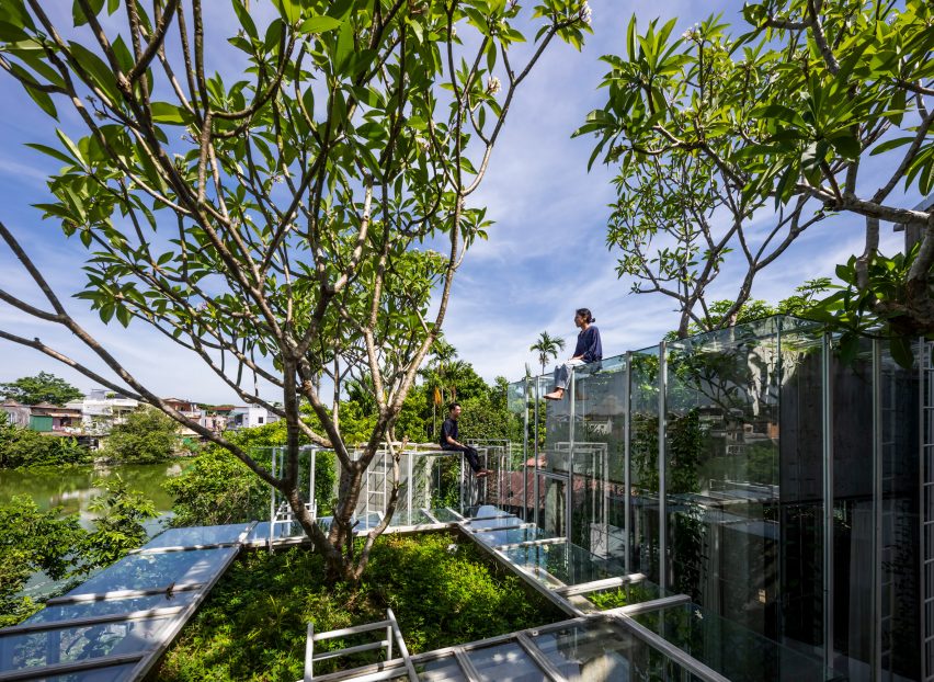People on the roof of La Bree House designed by Nguyen Khai Architects & Associates