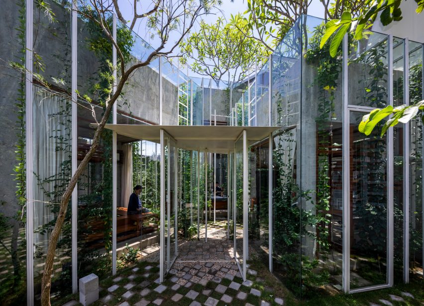 Entrance of a house covered with glass in Vietnam