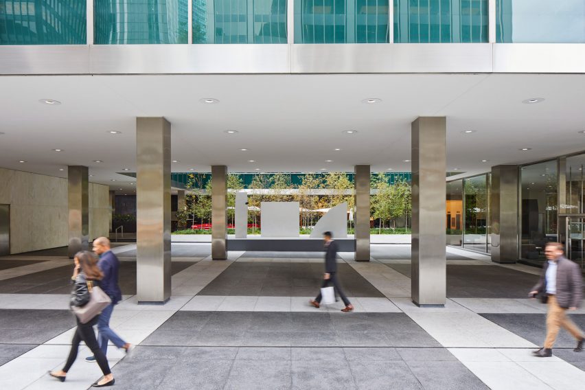 A covered plaza with gray and white terrazzo