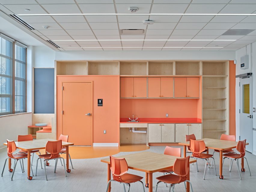 Orange details in elementary school classroom