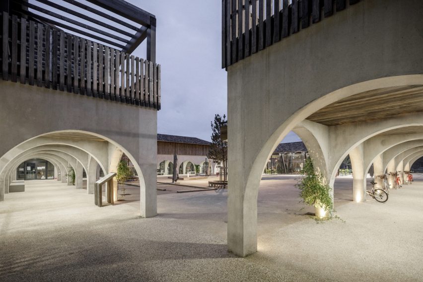 Arched colonnade at the Alzheimer's Village in France by NORD Architects