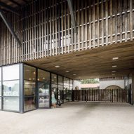 Entrance to the timber-clad Alzheimer's Village in France by NORD Architects