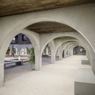 Wide concrete archways surrounding a courtyard