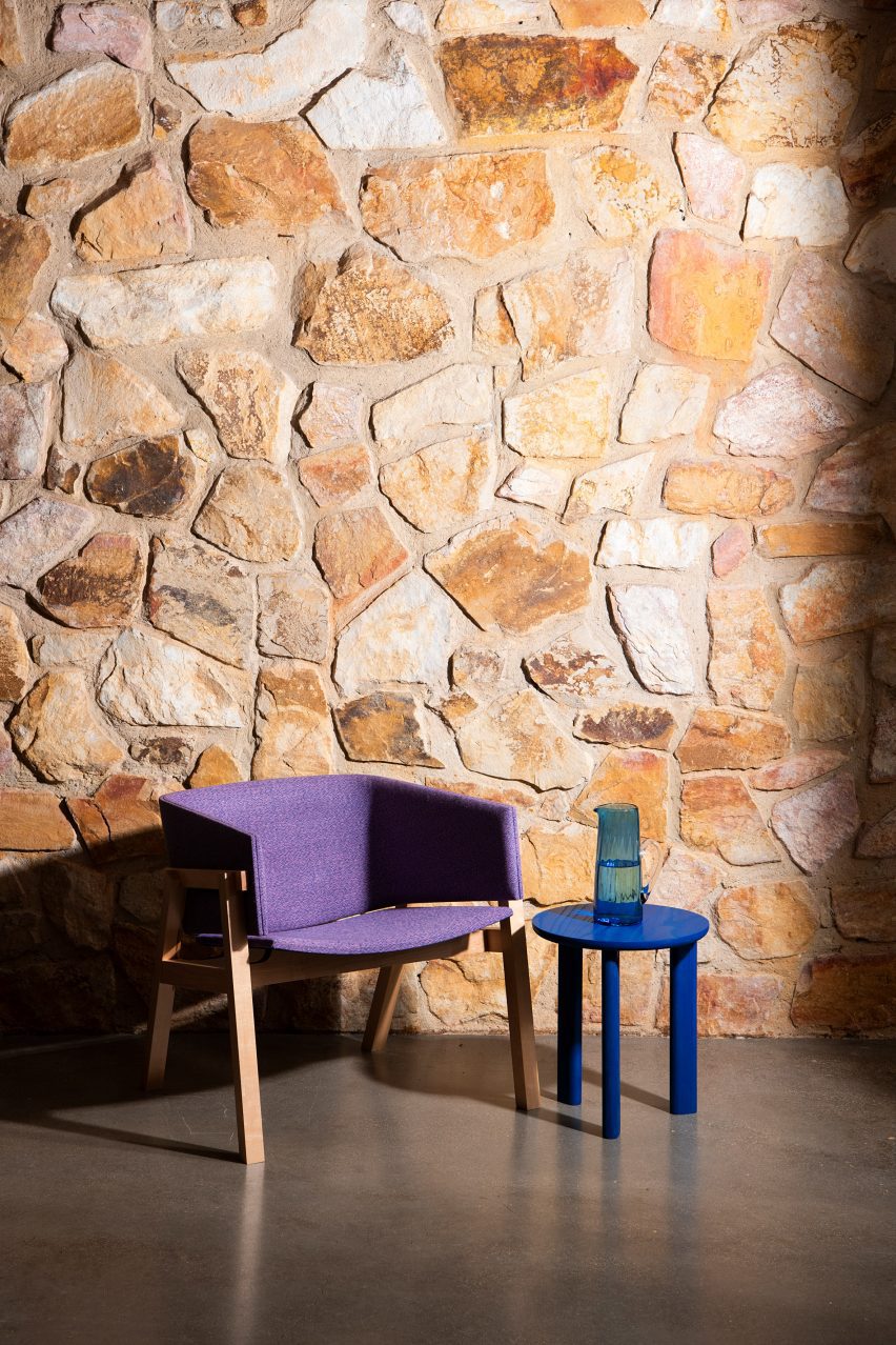 Blue side table beside purple chair