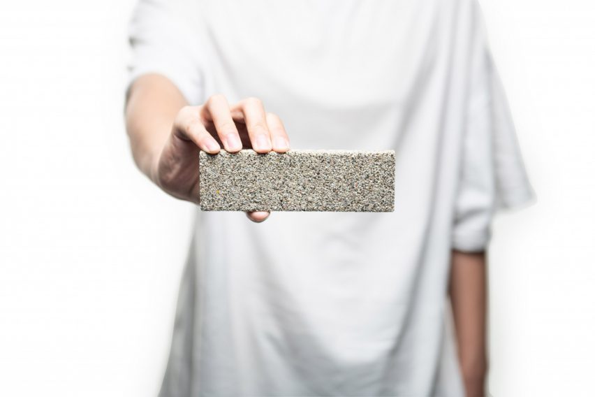 Person holding YiBrick Permeable by Yi Design