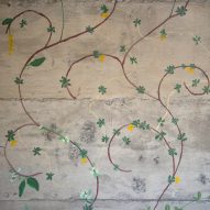 Flowers painted on concrete walls inside stairwell