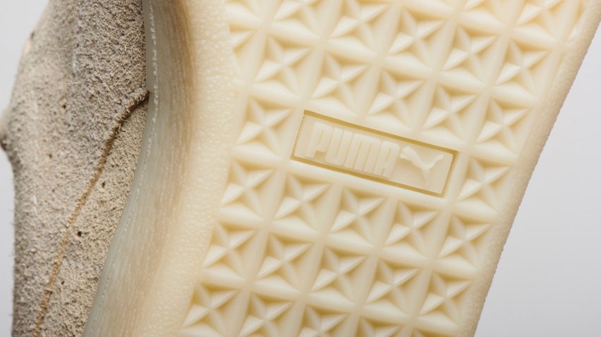 Close-up photo of the beige-coloured rubber outsole of Puma's Re-Suede biodegradable sneakers, showing tread and a Puma logo