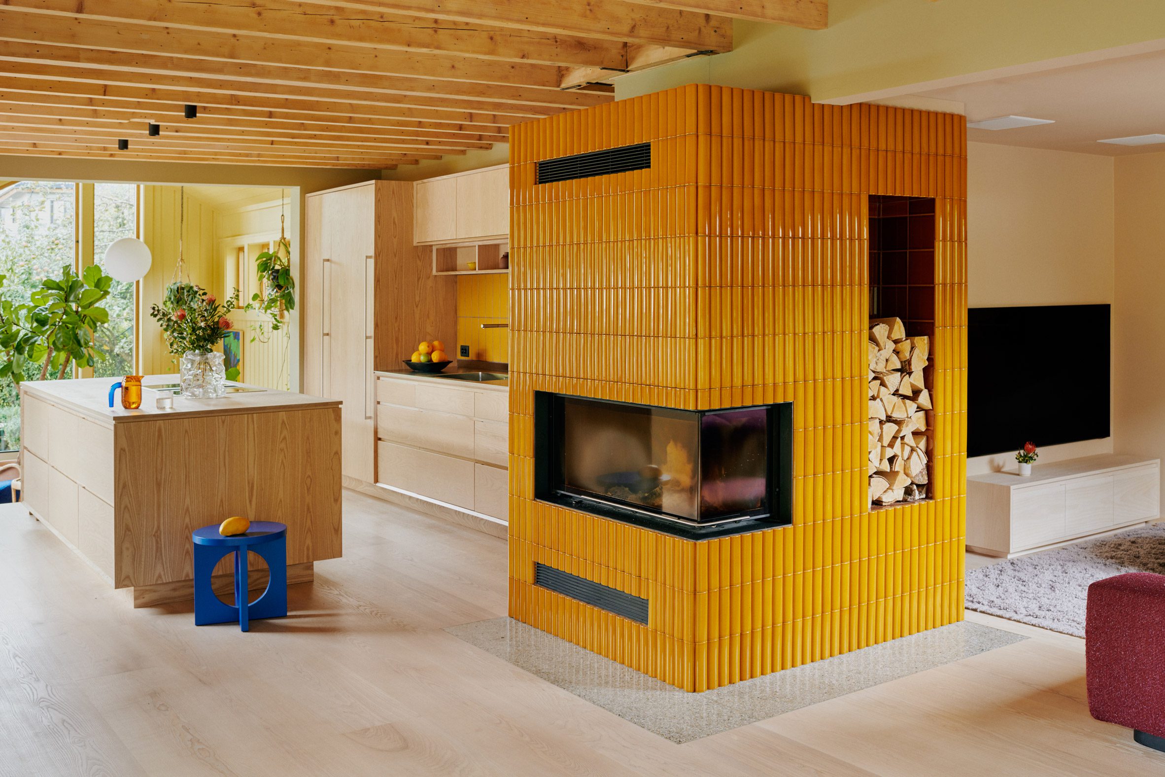 Fireplace with yellow tiles by Familien Kvistad